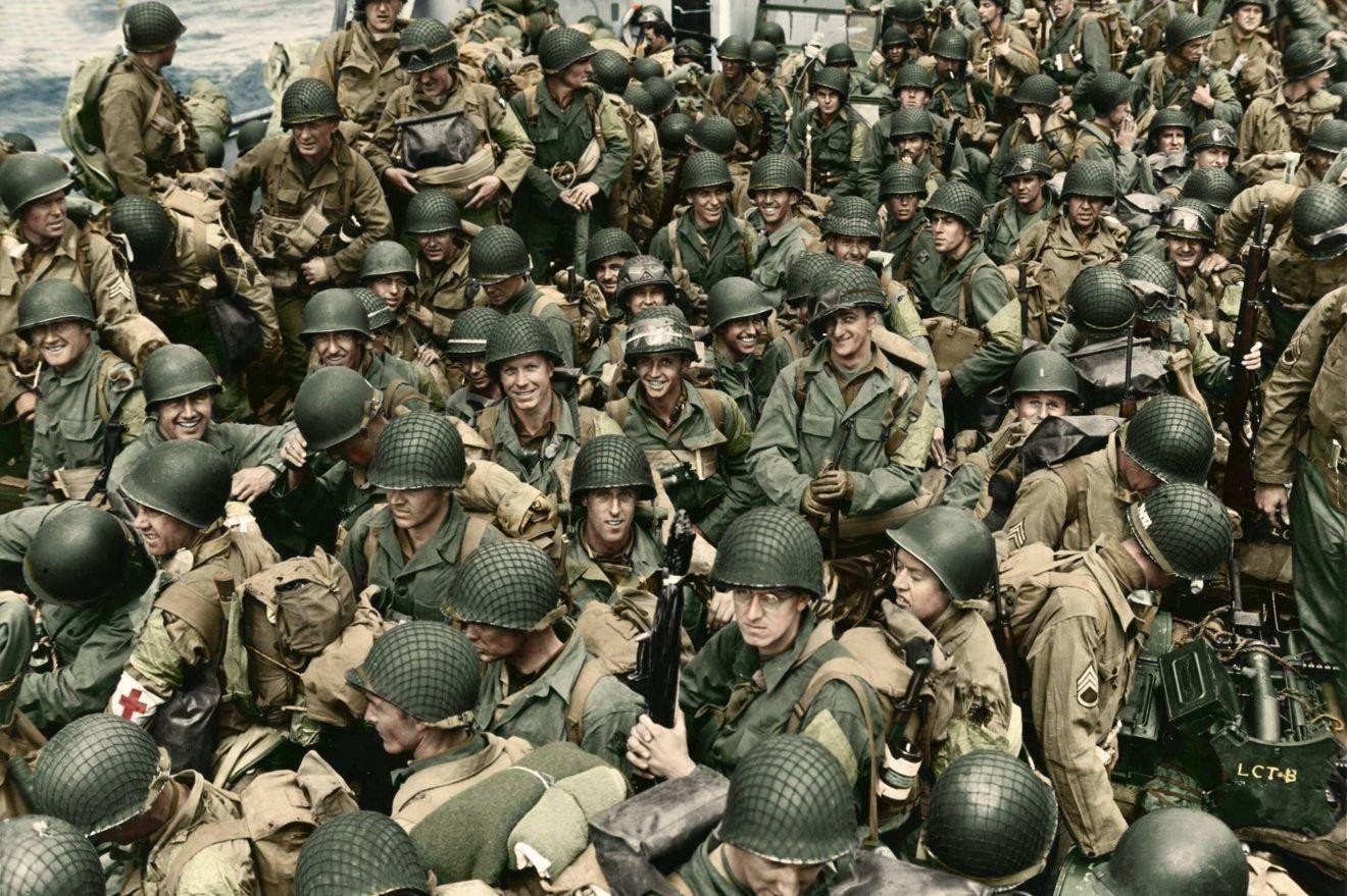 Colorized D-Day photograph of American soldiers gathered aboard a landing craft before going ashore in Normandy.