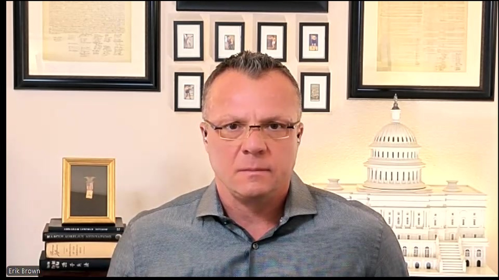 Verified remote interview frame of Erik E. Brown from the archived Al Qahera News appearance.