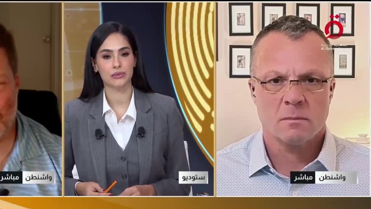 Erik E. Brown appearing from Washington on Al Qahera News alongside broadcast footage during a discussion of Pentagon leadership and military reform.